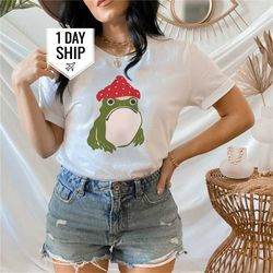 women frog with mushroom hat tshirt, frog tshirt, frog lover tshirt, mom life tshirt, gift for mom, tshirt designs, grap