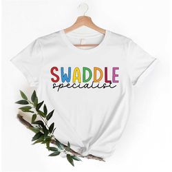 Swaddle Specialist T-Shirt, Mother Baby Nurse Shirt, Labour And Delivery Tee, Trendy Newborn Outfit, Postpartum Gift Ide