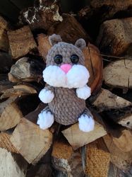Crochert hamster. Knitted plush hamster. The Hamster toy is crocheted with your own hands.