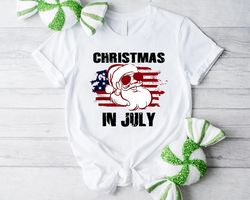 Christmas in July Shirt, US Flag Christmas in July Tshirts, Summer Holiday Santa Claus Shirt, USA Family Summer Vacation
