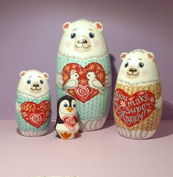A love bear matryoshka doll. Set of 4 hand-painted wooden dolls . Cute polar bears and a penguin .gift for a loved on