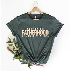 Surviving Fatherhood One Beer at a Time Shirt, Husband Gift, Father's Day Gift, Gift for him, Gift for Dad, New Dad Shir