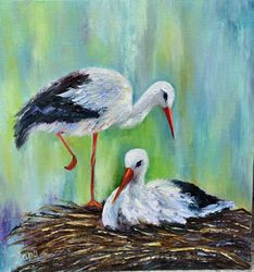 A family of storks in the nest. Peaceful family life in painting. Interior painting of a bird