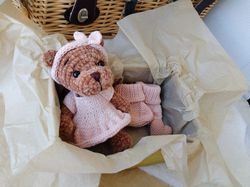 Teddy bear and booties baby gift for mom.Teddy bear, pink baby shoes, mini heart. Nice gift for the birth of a baby