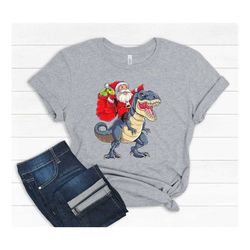 Cute boys Christmas Shirt, Santa riding Dinosaur shirt, Christmas gift for boys,  Cute Funny xmas tee  Christmas New Yea