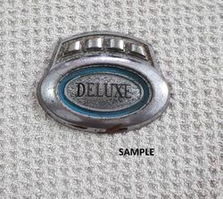 Delux Car Emblem In Metal Sample
