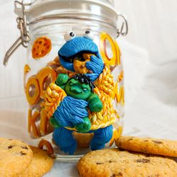 Cookie jar Cookie Monster with a Hulk toy