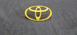 Toyota Logo In Gold Metal