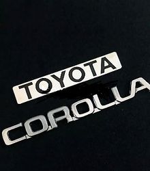 Toyota Corolla 84 to 91 Emblem Set Lacquer Coated