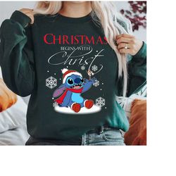 Disney Santa Stitch Christmas Begins With Christ Shirt, Lilo and Stitch Christmas Shirt, Disneyland Christmas Squad Swea