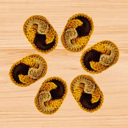 A crochet oval hair clip