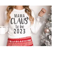 mama claus to be in 2023 svg, new baby svg, christmas baby svg, pregnancy announcement svg, holiday baby svg, baby surpr