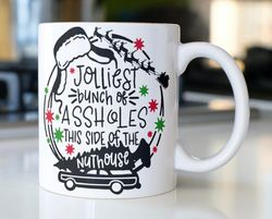 Funny Clark Griswold Christmas coffee mug stating, Jolliest bunch of Assholes This Side Of The Nutho