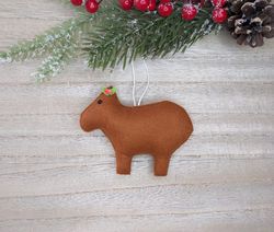 capybara, christmas capybara toy, capybara with pink flower, capybara christmas tree toy.