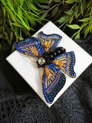 Brooch-pin made of beads and Swarovski crystals in the form of an embroidered Butterfly