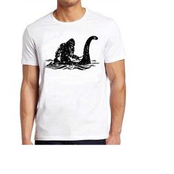 Bigfoot Riding  Loch Ness Monster Funny Meme Gift Tee Gamer Cult Movie Music  T Shirt 716
