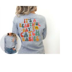 it's a beautiful day to catch babies sweatshirt, midwife sweatshirt, labor and delivery nurse gift, ob doctor gift, nicu