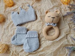 Gift box for baby set gray rodents bear, crown, booties. Christening or expecting a baby. Gift set for a newborn baby