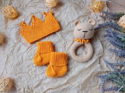 Gift box for baby set orange rodents bear, crown, booties. Christening or expecting a baby. Gift set for a newborn baby