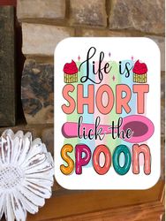 Funny Kitchen sign stating  Life Is Short Lick The Spoon