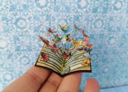 Miniature book with flying butterflies.1:12 scale.