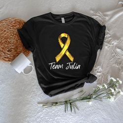 personalized childhood cancer tee, custom cancer gift, childhood cancer team tshirt png, child cancer squad tee, gold ri