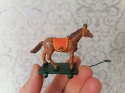 Horse on a gurney for a dollhouse.