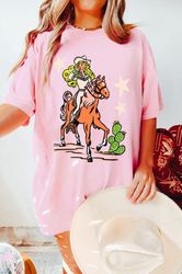 western graphic tee, retro rodeo doll tshirt, cowgirl graphic t shirt, western doll, pink cowgirl doll shirt, rodeo