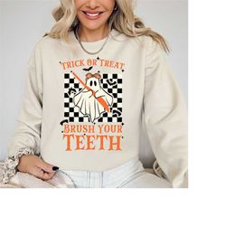halloween dentist shirt, trick or treat brush your teeth tee, spooky dental assistance gift, spooky dental hygiene denti