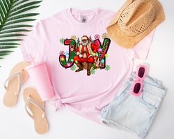 Brown Santa Joy Unisex Shirt, Brown Santa, Unisex Shirt, Grinch Era, Christmas, Trending Christmas, Pink Christmas