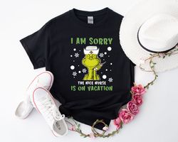 Spread Some Cheer with this Nurse Christmas Shirt - Perfect for Grinch-loving Nurses! 1