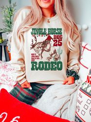 Jingle Horse Rodeo Sweatshirt Vintage Cowboy Santa Claus Shirt Giddy Up Howdy Christmas Pyjamas Gifts for Her Him Wester
