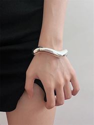 XIALUOKE Abstract Metal Cuff Bracelet: Stylish Irregular Wrist Jewelry for Women in European and American Fashion