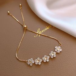 Gold Flower Charm Bracelet with Inlaid Rhinestones - Elegant Korean Fashion Jewelry for Women, Perfect Party Gift