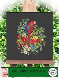 Antique cross stitch pattern of birds and acorns. Parrot in flowers.