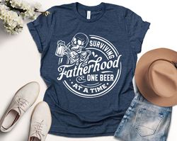 Fatherhood surviving one beer at a time, Skull, Funny, Fathers Day Shirt, Trendy Daddy Shirt, Dad , Dad T-Shirt, Fathers