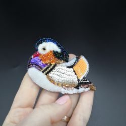 A brooch made of beads Mandarin duck