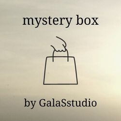 Mystery box with a set of 2 corner bookmarks, a mystery surprise box for book lovers