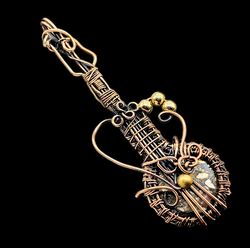 Harmony Unleashed: Wire Wrapped Guitar Pendant in Dragon Bloodstone