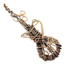 Shiva Eye Symphony: Wire Wrapped Guitar Pendant for Music Enthusiasts and Spiritual Souls