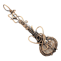 Melodic Radiance: Rose Quartz Copper Wire Wrapped Guitar Pendant for Musical Elegance and Positive Energy