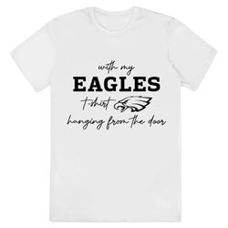 Retro Taylor Swift Eagles T-Shirt With My Eagles T-Shirt Hanging From The Door