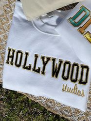 Hollywood Studios Metallic Patch Embroidered Sweatshirt   Embroidered Sweatshirt  Disney Embroidered Crewneck
