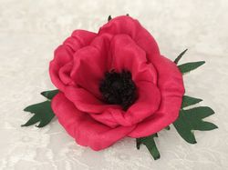 Artificial cloth maroon anemone flower. Satin ribbon fabric flower for clothing. Sewing embellishment for dress