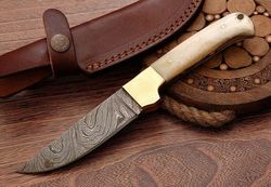 Custom handmade Damascus steel hunting knife with camel bone and brass bolster and pins.