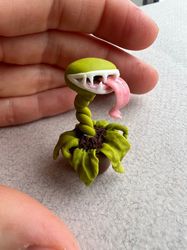 Miniature for a dollhouse. The flower is fantastic) made of polymer clay.the flower is bright and beautiful, it will dec