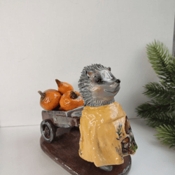 A hedgehog with a wheelbarrow.
