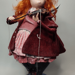 A doll with a violin.