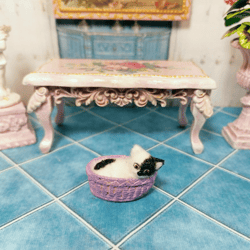 Cat in a basket. Dollhouse miniature.
