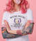 portrait-of-young-amazed-beautiful-pink-haired-lady-with-tattooed-hands-wears-in-white-t-shirt-blows-gum-ball-looking-to-the-left-in-surprise-stands-with-copy-s